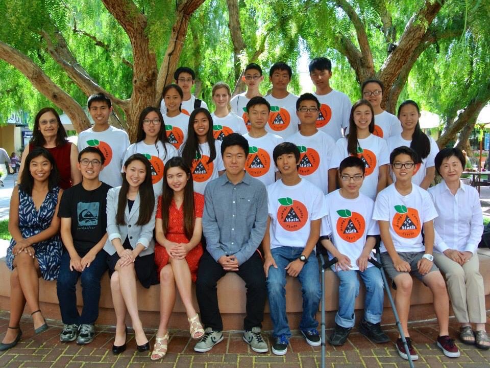 Orange County Math Circle volunteers and mentors, including Mrs. Li, gathered for a group photo.