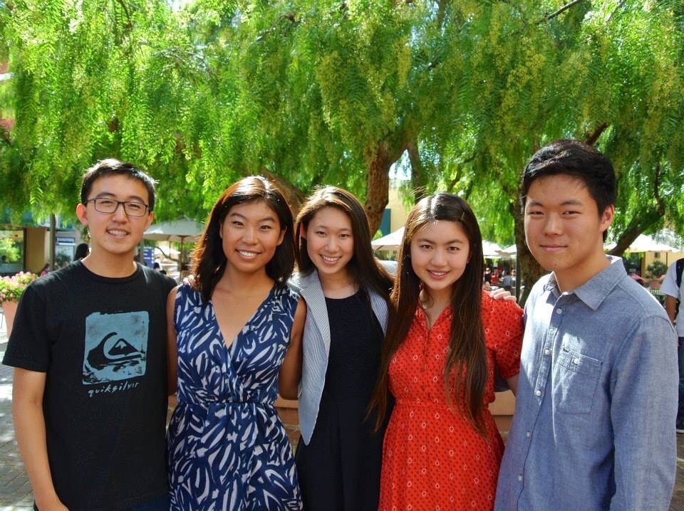 Five OCMC student leaders standing together outdoors under a pepper tree.